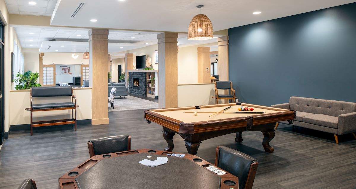 game room with poker table and billiards table